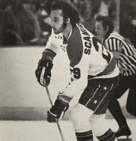 https://upload.wikimedia.org/wikipedia/en/4/42/Peter_Scamurra_Ice_Hockey_Player_for_the_Washington_Capitals_1977.jpeg