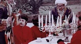 The clip's closing scene, in which the Beatles drink tea at an outdoor table and are presented with their guitars