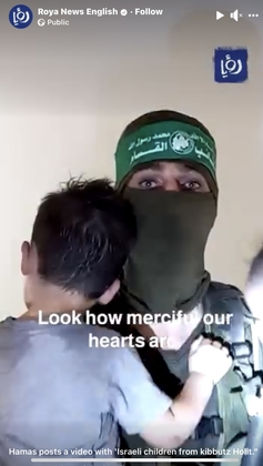 File:Hamas militant holding toddler and baby.jpeg