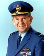 Formal head-and-shoulders portrait of man in blue military uniform and peaked cap