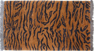 A Tibetan tiger rug (modern) with and abstract pelt design. Rugs like this were used as meditation seats when tiger skins were unavailable TibetanTigerRugModern.jpg