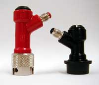 Pin lock (left) and ball lock quick-connect fittings, which mate to the keg ports. Hoses attach to the threaded flare fittings seen at the top. Fittings are color-coded for whether they connect to the gas (gray) or liquid (black or metal) port; these specimens are both for liquid lines. Pinballlock.jpg