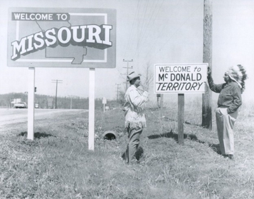 File:President McGowan and Cherokee Chief Henry Saugee displaying Welcome to McDonald Territory sign.jpeg