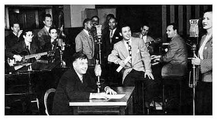 In this CBS publicity photo of Arthur Godfrey Time, vocalist Patti Clayton is seen at the far right and Godfrey sits in the foreground. Clayton, the original 1944 voice of Chiquita Banana, was married to Godfrey's director, Saul Ochs.