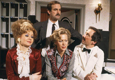 Cast of Fawlty Towers, left to right: (front) Prunella Scales (Sybil Fawlty), Connie Booth (Polly) and Andrew Sachs (Manuel); (back) John Cleese (Basil Fawlty)