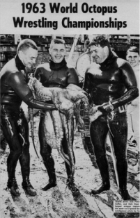 Three divers holding the largest catch of the 1963 World Octopus Wrestling Championships, a 57-pound giant Pacific octopus.