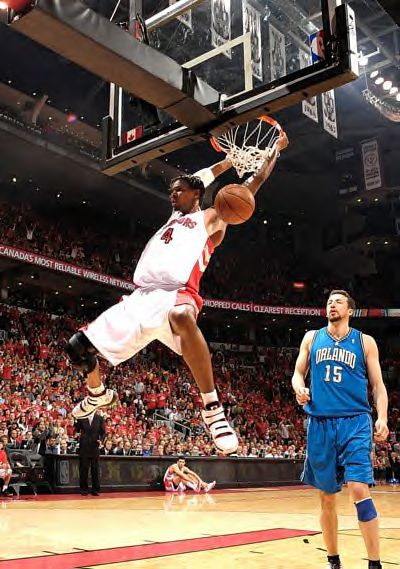 Chris Bosh dunks the ball against the Milwaukee Bucks