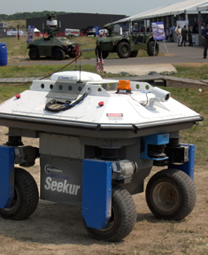 The Seekur and MDARS robots demonstrate their autonomous navigation and security capabilities at an airbase.