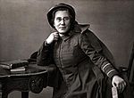 A women in a Salvation Army uniform sits at a desk