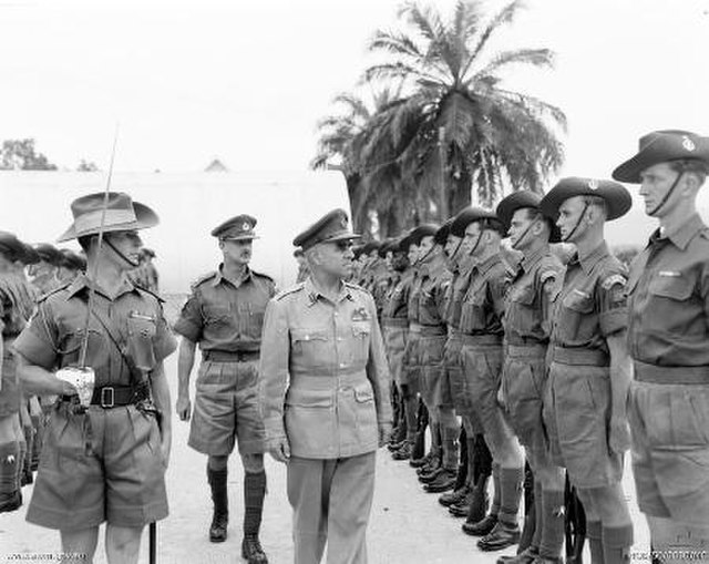 Lieutenant General Sir Henry Wells, Chief of the General Staff, inspects troops from 2RAR in Malaya c. 1956.