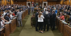 Justin Trudeau as he grabs the arm of Conservative Whip Gord Brown Elbowgate CPAC screenshot.png