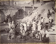 Women and children at a bathing ghat on the Ganges in Banares (Varanasi), 1885.