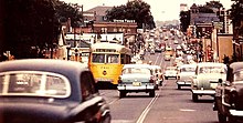 Southbound view of Harford Road at White Avenue showing streetcars and automobiles (1956) Baltimore-Harford-Road-Southbound-at-White-Avenue-1956.jpg
