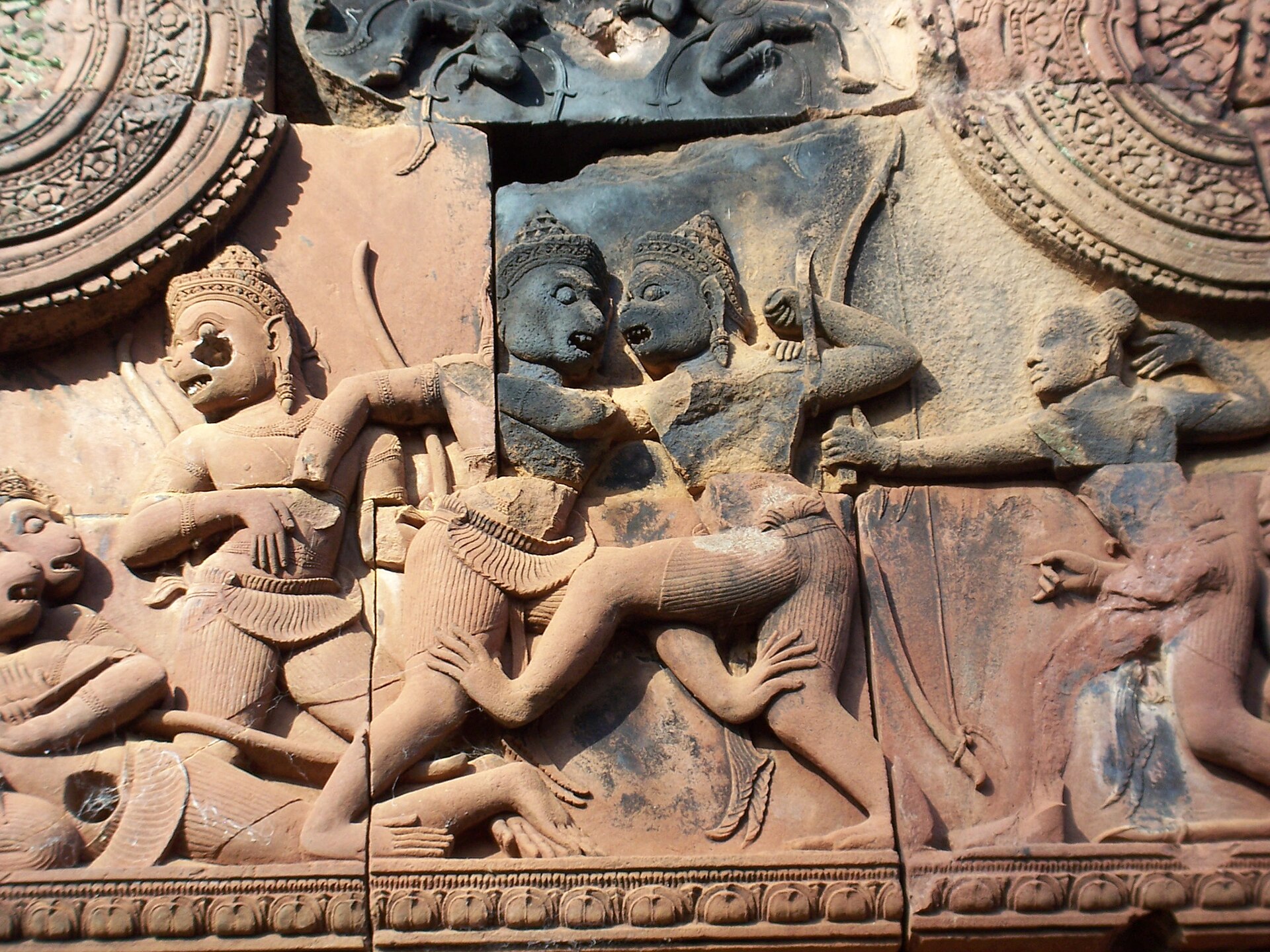 This tympanum from the Khmer temple of Banteay Srei depicts Sugriva fighting with his brother Bali. To the right, Rama is poised to shoot an arrow at Vali.