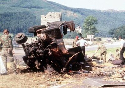 A British Army lorry destroyed in the ambush. The hills of the Cooley Peninsula in County Louth can be seen in the background, behind Narrow Water Cas