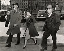 Emma Woikin (centre) following a court appearance in March 1946. Emma Woikin following court appearance, March 1946.jpg