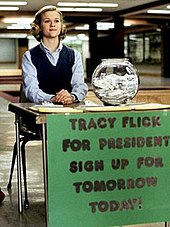 Witherspoon as Tracy, greeting students during her election campaign TracyFlick.jpg