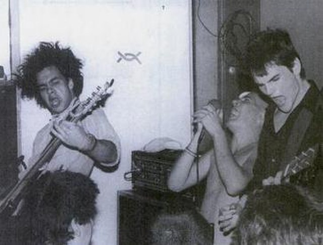 Embrace at Food for Thought in July 1985. From left to right are Chris Bald, Ian MacKaye, and Mike Hampton. Band's drummer, Ivor Hanson, is out of fra