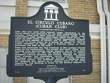 Informational sign in front of Cuban Club Circulo cubano sign.JPG