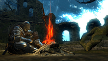 A player character in Dark Souls using a bonfire Dark Souls Bonfire.png