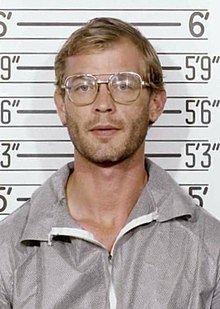 American serial killer and sex offender Jeffery Dahmer in a mugshot taken by the Milwaukee Police on July 23, 1991. He is wearing a gray sweater and clear glasses.