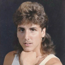 A 1980s promotional portrait picture of American record producer Mike Dean.