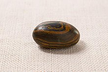 Many members of the Church of Jesus Christ of Latter-day Saints believe that Joseph Smith used this seer stone (along with two others dubbed the "Urim and Thumim") in the Book of Mormon translation effort. Seer stone (Latter Day Saints).jpg
