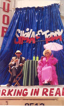 Winchell (right) providing commentary at the 1998 Christopher Street West Gay Pride Parade in West Hollywood.