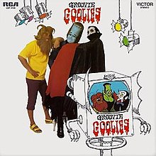 Ed Fournier (Wolfie), Jeffrey Thomas (Frankie) and Dick "Daddy Dewdrop" Monda (Drac) with their animated counterparts. Groovie Goolies LP.jpg