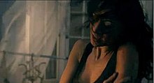 A single frame from the music video, filmed by Rich Lee. In the frame, Scherzinger sings in front of the camera in the old house. DHYB video.jpeg