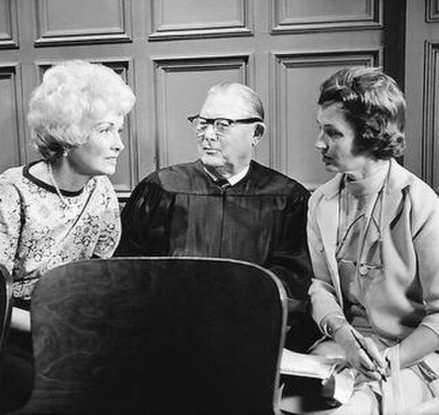 Perry Mason executive producer Gail Patrick Jackson (left) and Erle Stanley Gardner speak with Hollywood columnist Norma Lee Browning during filming o