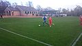 Hallam (in blue) on the attack in an NCEL match against Louth Town in 2014. The new clubhouse and main stand are in the background