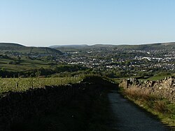 A view from near the top of Robin Hood's Well. Pendle Hill is just visible in the background.