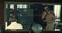 The moment where Sammy (Gabriel LaBelle) sees a vision of himself in the mirror filming the announcement of his parents' divorce with his 8mm camera as it happens in front of him was widely analyzed. Fabelmans Mirror Shot.jpg