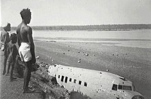 United States DC3, destroyed in Japanese raids on Bathurst Island Mission, Bathurst Island, Northern Territory. USAAC C-49 Bathurst Island NT Library image number PH0401-0665.jpg