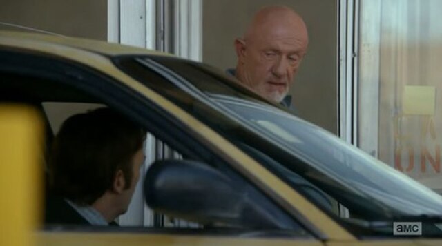 Jimmy McGill argues with parking attendant Mike Ehrmantraut. The actors who play them, Bob Odenkirk and Jonathan Banks, reprise their roles from Break