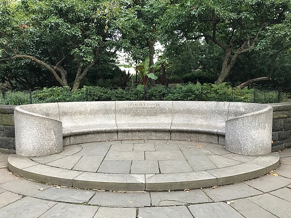 The Charles Bunstein Stover Memorial Bench in Central Park. The inscription reads, "CHARLES B. STOVER 1861-1929. Founder of outdoor playgrounds, who devoted his life to public service. In Grateful Recognition 1936"