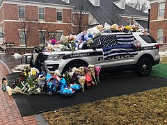 A memorial for officers Anthony Morelli and Eric Joering outside the Westerville Police Department.jpg