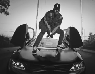 Tiller standing on a BMW i8 in the music video for "Self-Made". Bryson Tiller - Self-Made (official music video).png