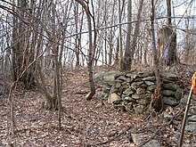 The remains of a stone wall at Hanton City, with surveyor's tape Hanton City Wall 1.jpg