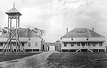 The first House of Assembly of Vancouver Island was sworn in while in the "bachelor's mess" (visible on the left) in Fort Victoria Fort-victoria.jpeg