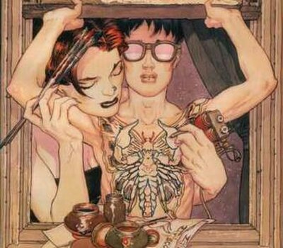 Portion of the cover of issue #22, showing Tim's moth/scorpion tattoo.