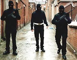 A UVF publicity photo showing masked and armed UVF members on patrol in Belfast UVFVolunteers.jpeg