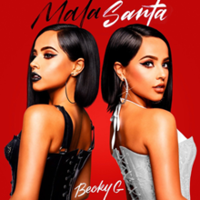 Red background with 2 Becky's facing left and right. Gomez on the left is wearing a black corset while the Gomez on the right faces the camera and wears a white corset. The title is written in black (Mala) and white (Santa), while her name is written in white at the bottom.