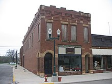 The old hardware store, partially restored and housing an antique store. McMullenCompany.JPG