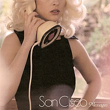 A blonde woman in a black dress holds a landline phone to her ear, with the band's name and song title displayed in white text at the bottom right of the image
