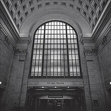A black-and-white photo of a train station