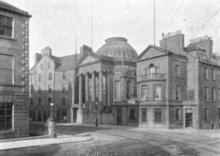 The Marshall Monument around 1900, prior to the demolition of the building to the left of it, which was replaced by today's museum and art gallery Marshall Monument c. 1900.png
