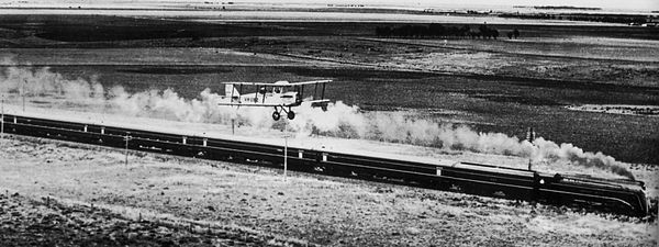 The Spirit of Progress racing an Airco DH.4 aeroplane between Melbourne and Geelong on 17 November 1937