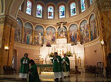 Servers at Mass in the church in 2020 StStanAltar.jpg